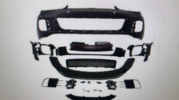 Front bumper in sports design, with grills and fog lights, for P
